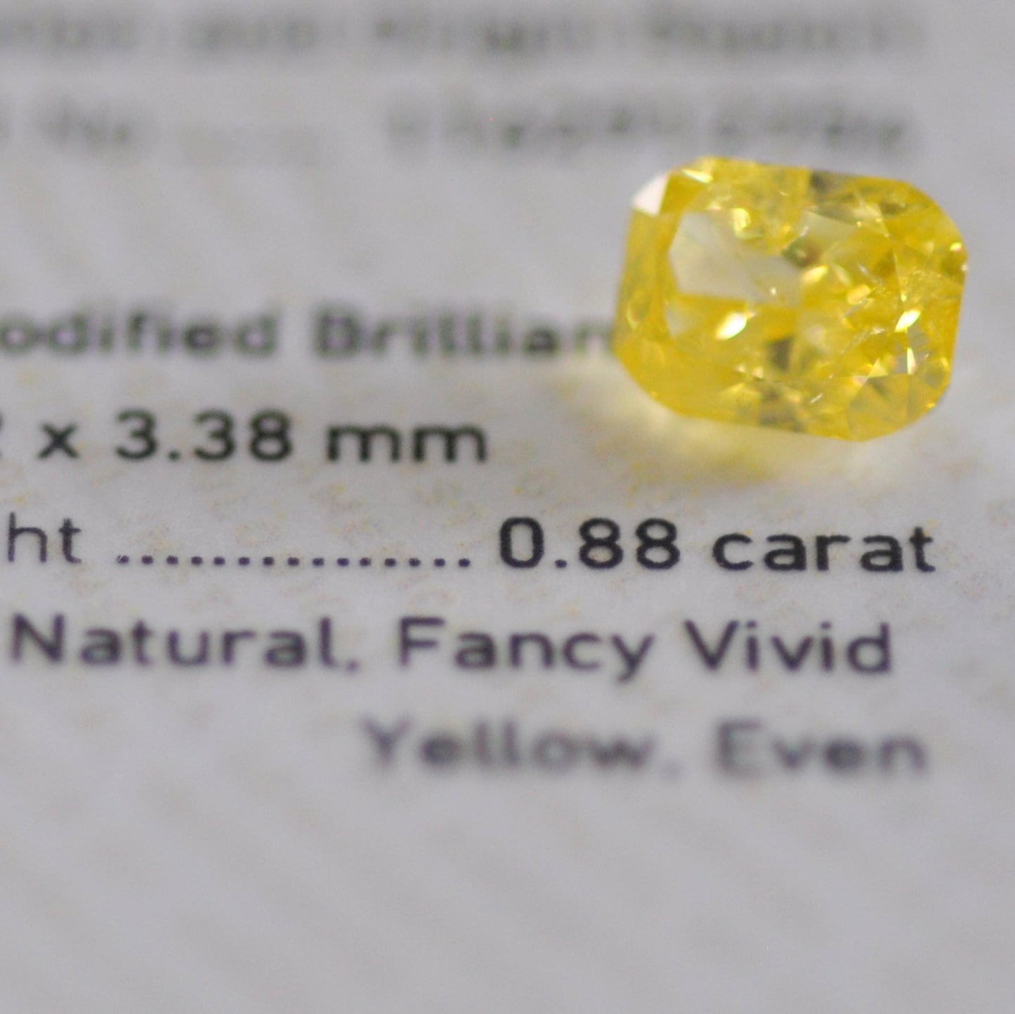 Fancy Vivid Yellow 0.88 ct.