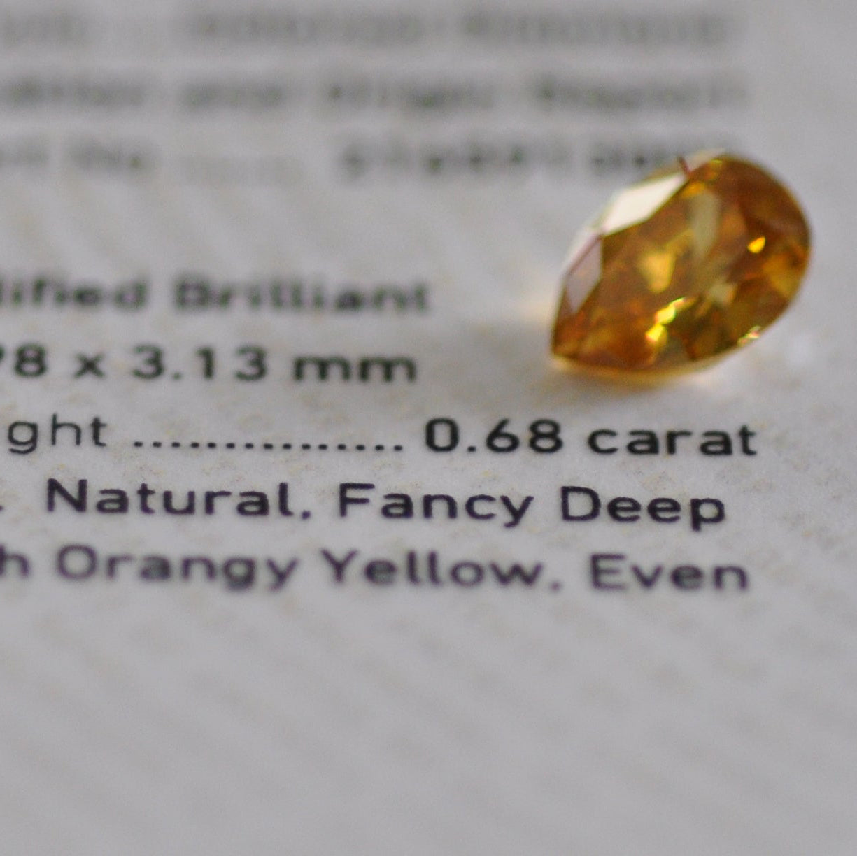 Fancy Deep Brownish Orangy Yellow 0.68 ct.